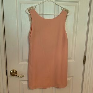 Light pink, short dress with open back